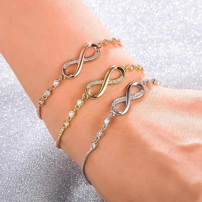 Adjustable silver infinity chain bracelet on wrist. By Sophi.