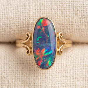 By Sophi Vintage Colorful Opal Ring flat-lay on warm cream