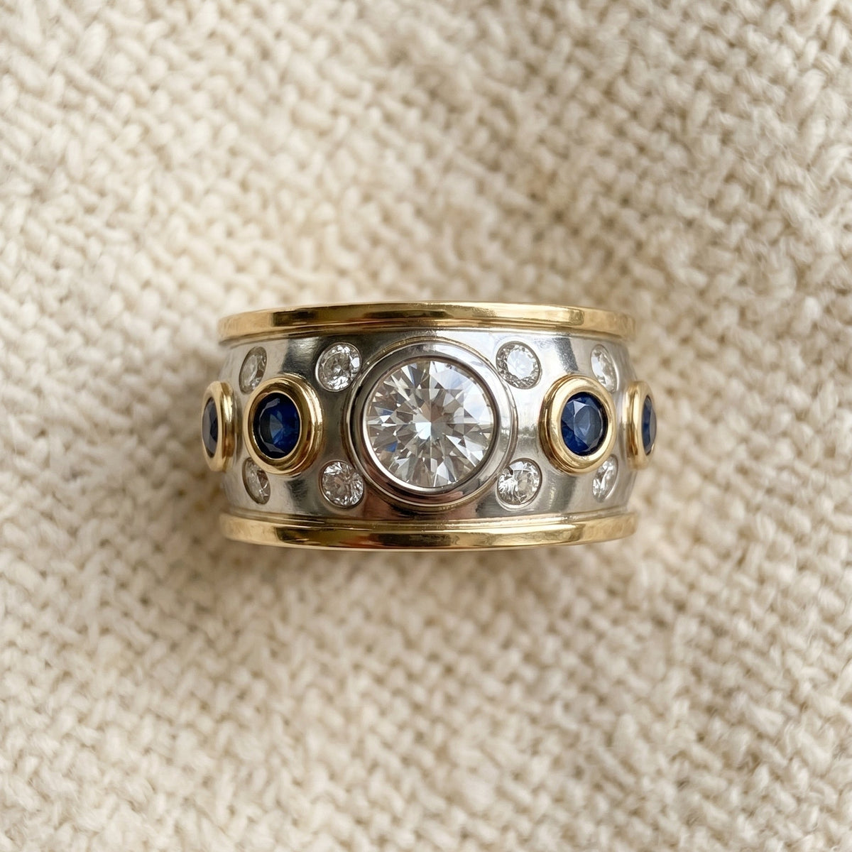 By Sophi Vintage Golden Inlaid Zirconia Ring, flat-lay on warm cream wool