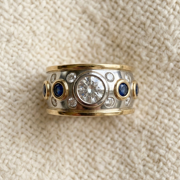 By Sophi Vintage Golden Inlaid Zirconia Ring flat-lay on   change background to  on warm cream  wool fabric background