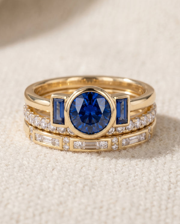 By Sophi Vintage Elegant Blue Zirconia Ring Set flat-lay on warm cream