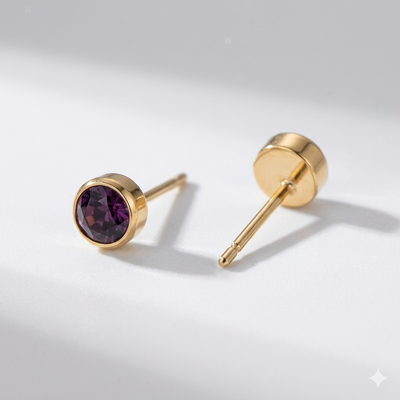 Garnet birthstone stud earrings in gold-toned bezel. By Sophi.