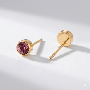Opal birthstone stud earrings in gold-toned bezel. By Sophi.