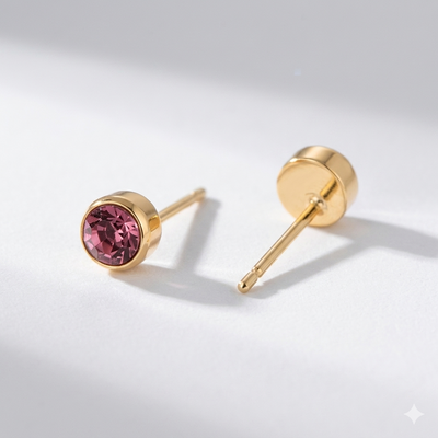Opal birthstone stud earrings in gold-toned bezel. By Sophi.