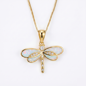 Dragonfly necklace in gold with small opal center. By Sophi.