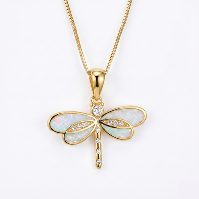 Dragonfly necklace in gold with small opal center. By Sophi.
