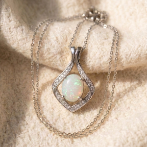 By Sophi Natural Opal Pendant Necklace, catalog flat-lay on warm cream wool