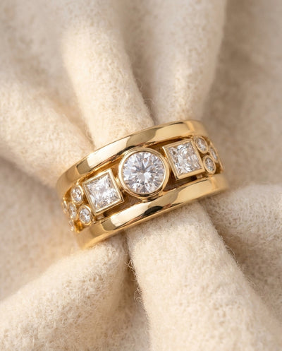 By Sophi Vintage Gold Zirconia Ring flat-lay on warm cream wool