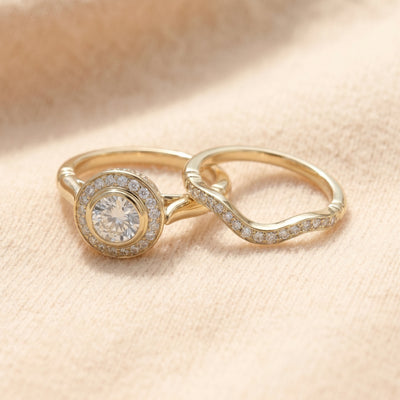 By Sophi Vintage Gold and Zirconia Ring Pack flat-lay on warm cream wool