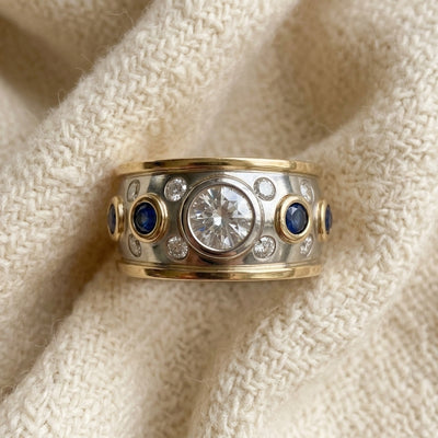 By Sophi Vintage Golden Inlaid Zirconia Ring, flat-lay on warm cream wool