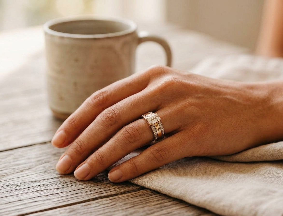 By Sophi Vintage Two-Tone Inlaid Crystal Glass Ring, worn on hand resting near a warm ceramic mug on wood
